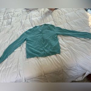 Lightweight pale turquoise 100 percent cashmere cardigan.  Lovely color.